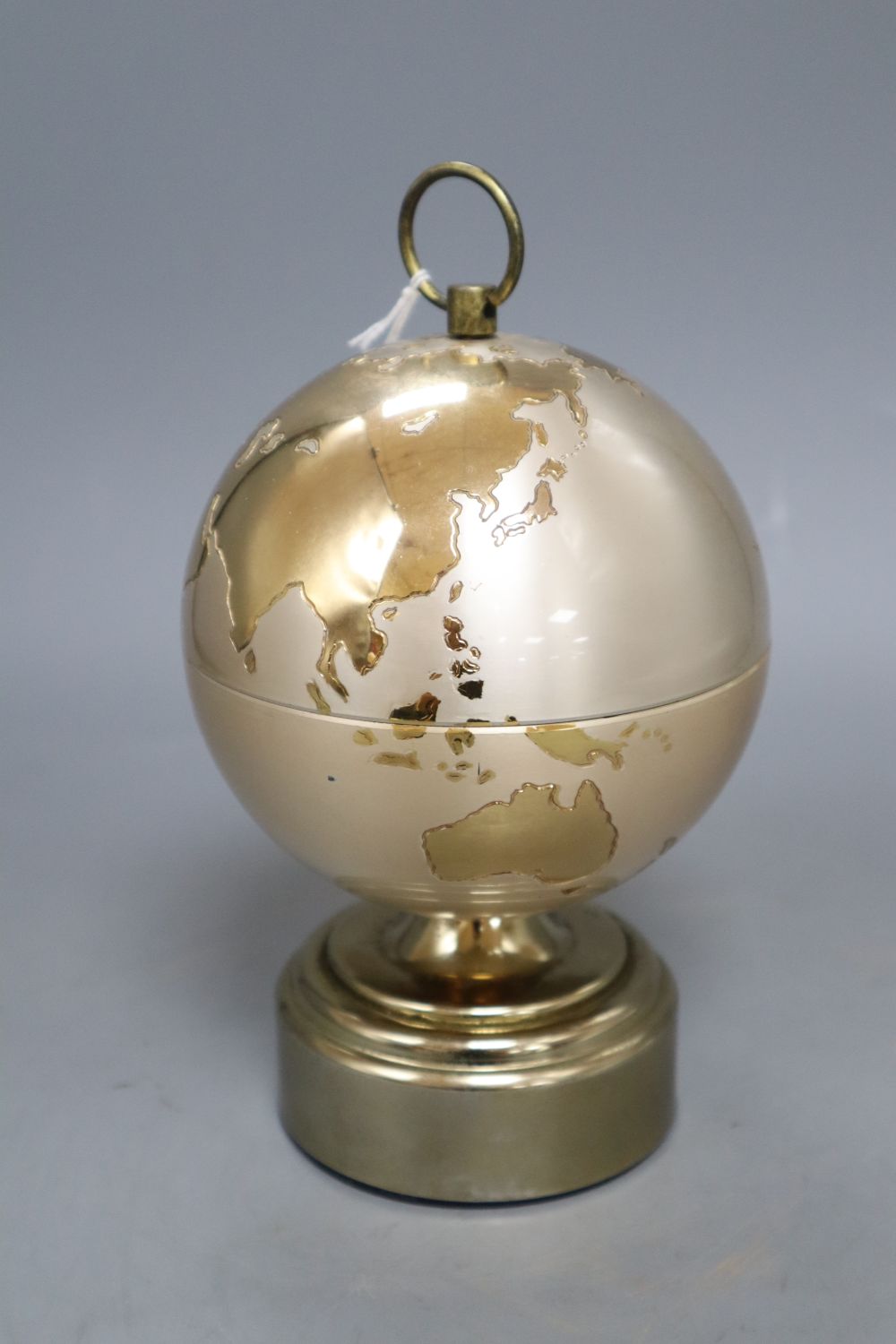 A novelty gilt metal globe musical cigarette holder, height 18cm